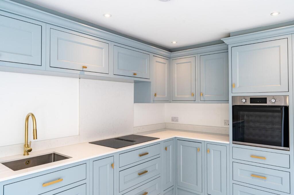 Detailed view of painted shaker kitchen cabinets