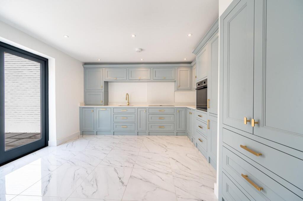 Alternative wide view of the pale-blue shaker kitchen